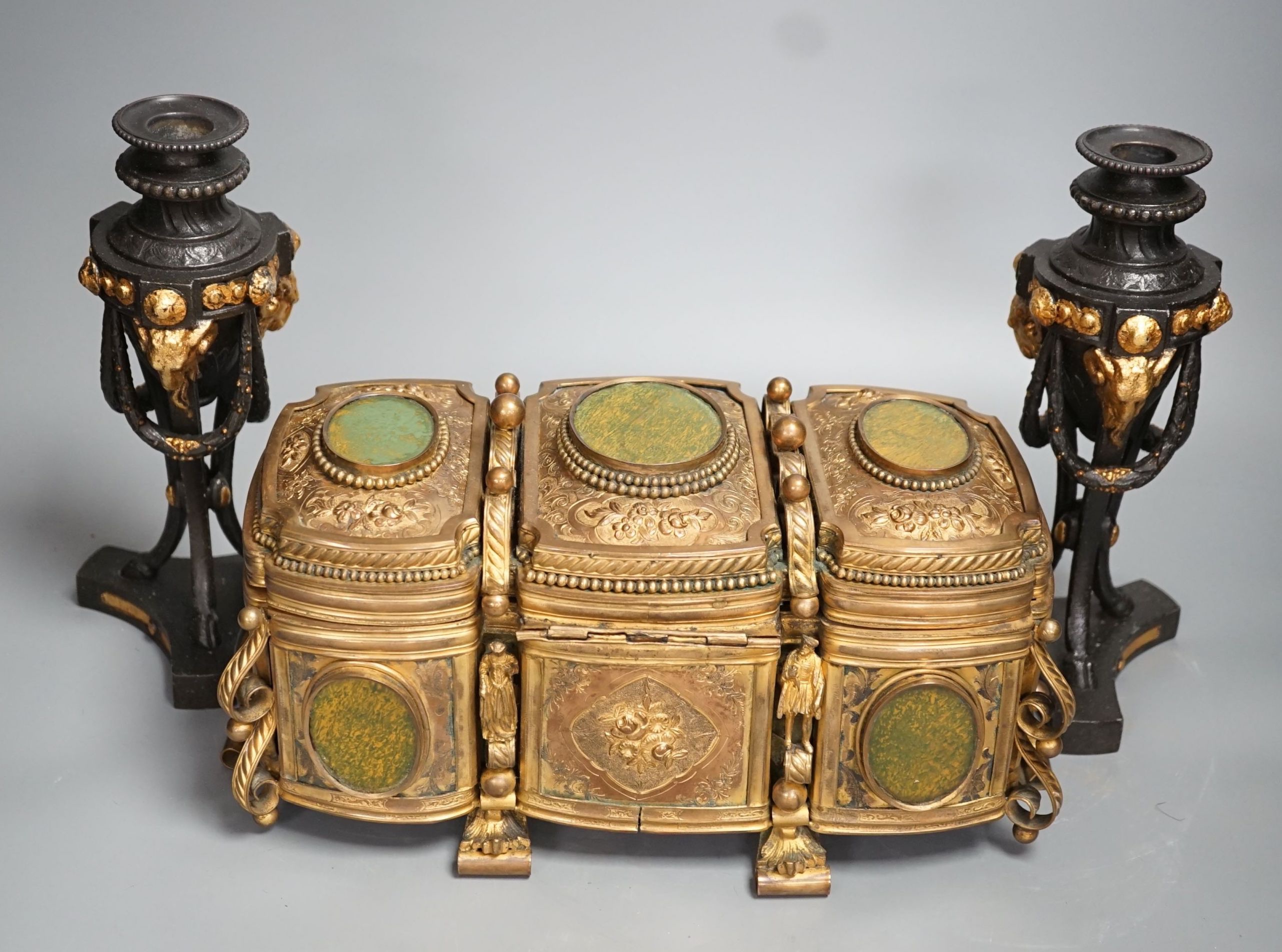 A French gilt metal casket inset with reverse painted glass panels and a pair of ormolu style candlesticks, 22.5cm tall